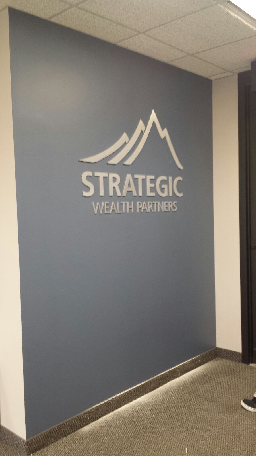 Strategic Wealth Partners "Invests" in Amazing Lobby Sign Strategic Wealth Partners "Invests" in Amazing Lobby Sign
